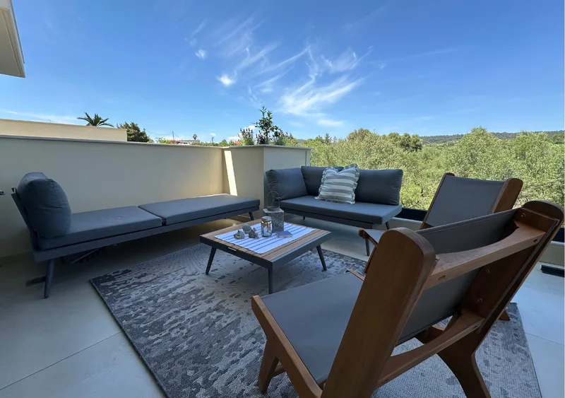 Spacious terrace with sunbeds, greenery and olive grove views in Gyalia House No. 3 Nikiti